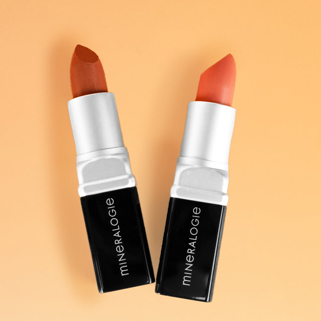 Pure Minerals Lipstick Glee and Nurture on peach background